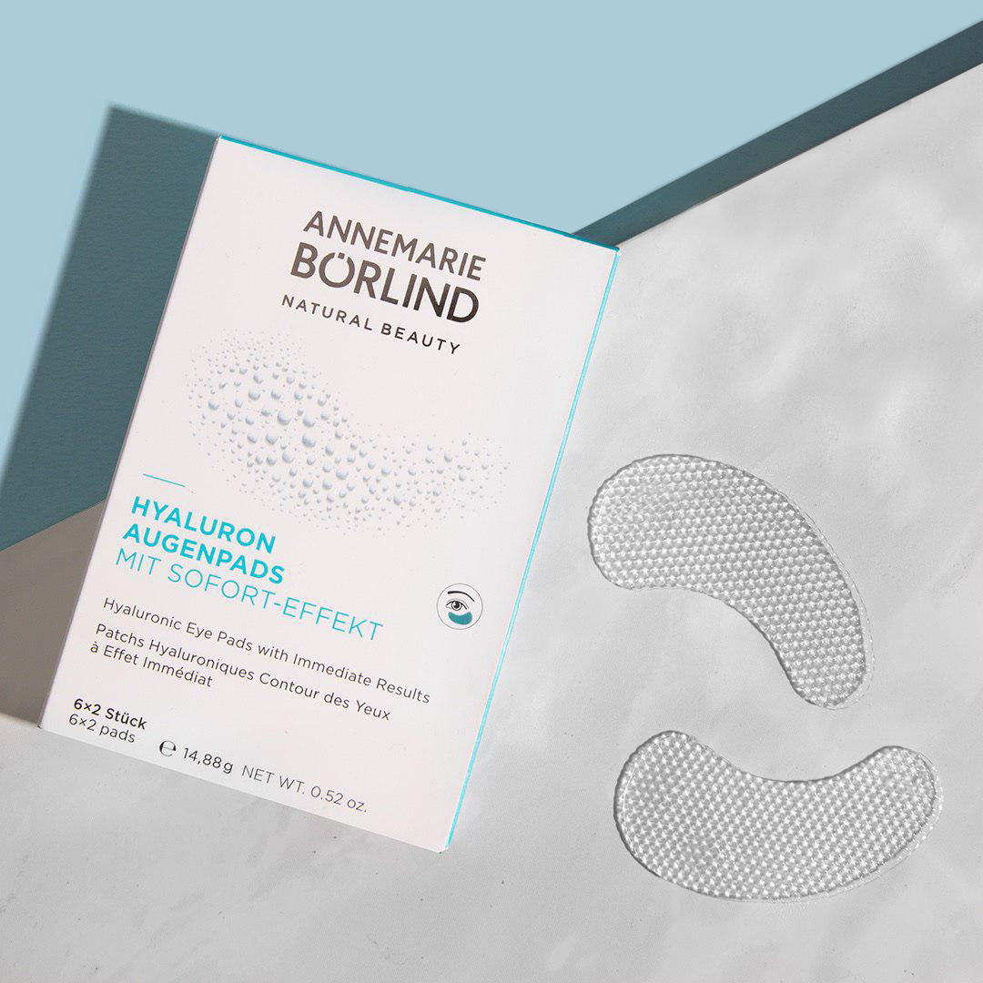 ANNEMARIE BÖRLIND Hyaluron Augenpads mit Sofort-Effekt, 6x2 Stück, transparente Gelpads neben Verpackung