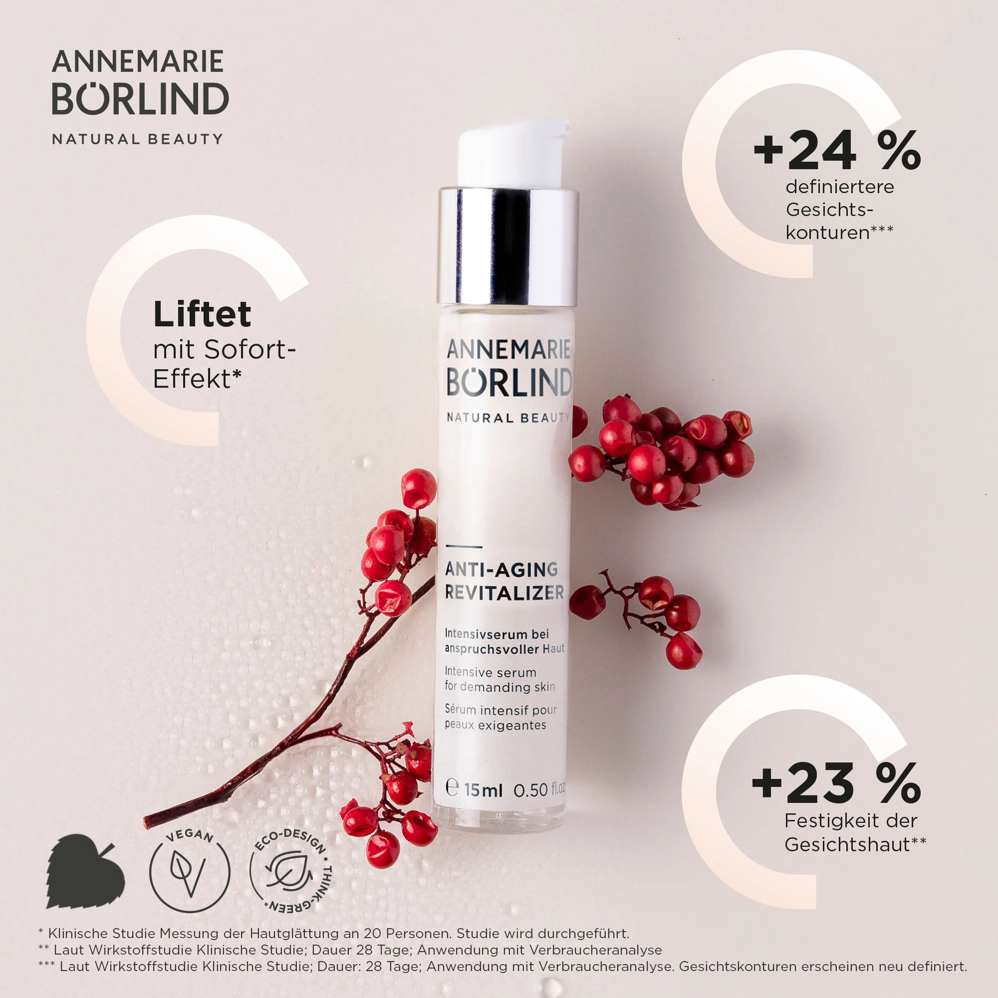 ANNEMARIE BÖRLIND Anti-Aging Revitalizer Serum mit 15 ml, umgeben von roten Beerenzweigen auf hellem Hintergrund