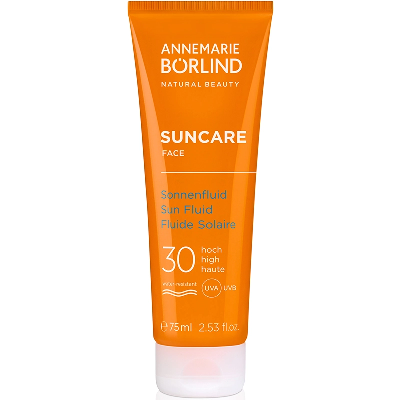 ANNEMARIE BÖRLIND SUNCARE Sonnenfluid für das Gesicht mit LSF 30 in orangefarbener Tube, wasserfest.