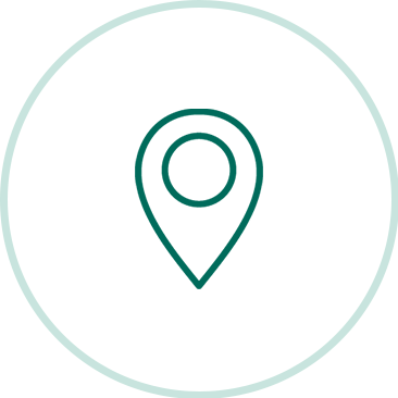 Symbol einer Standortmarkierung in grün auf weißem Hintergrund mit hellgrünem Kreis außenrum