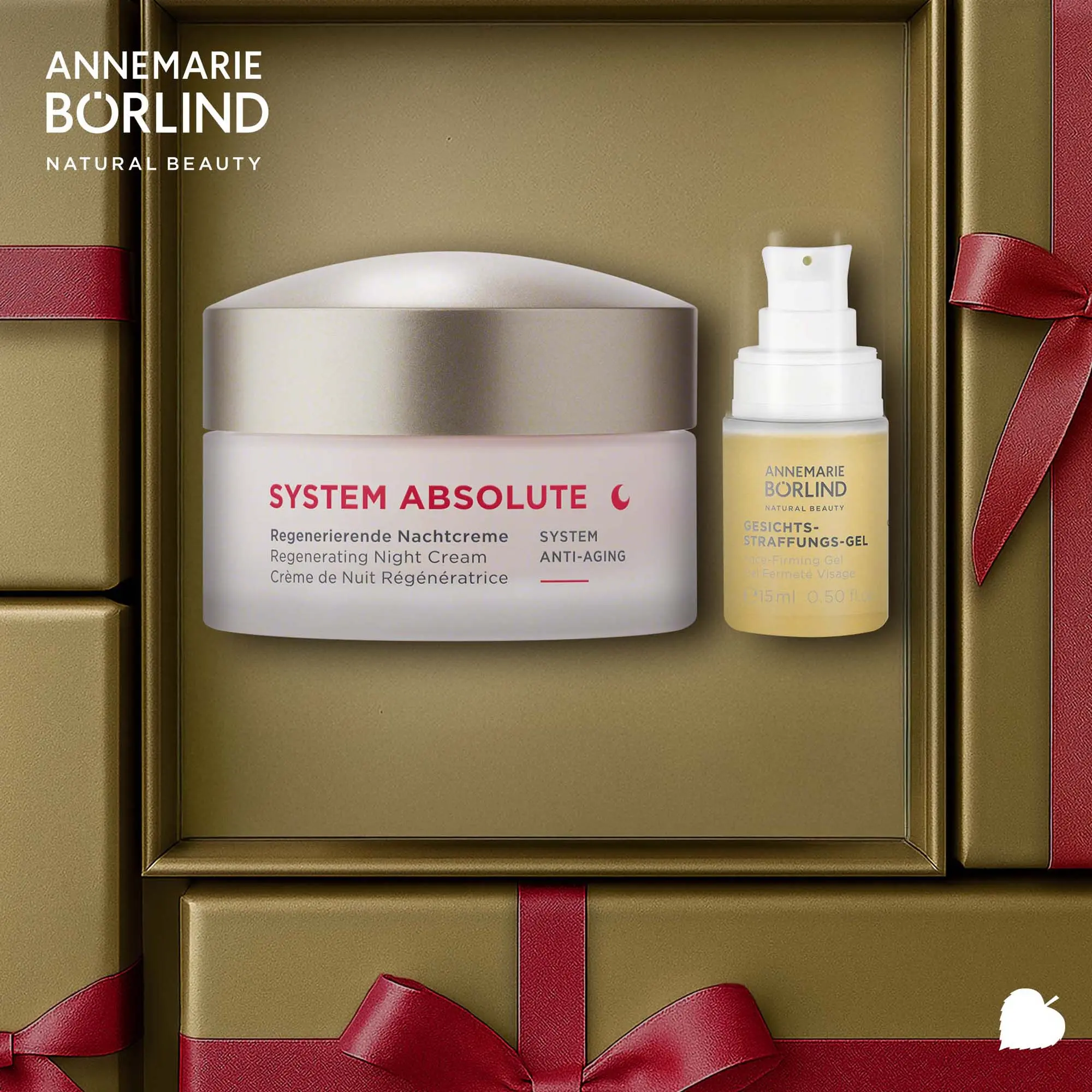ANNEMARIE BÖRLIND SYSTEM ABSOLUTE Winter Power Night Set mit Nachtcreme und Gesichtsstraffungsgel in goldener, festlicher Verpackung liegend