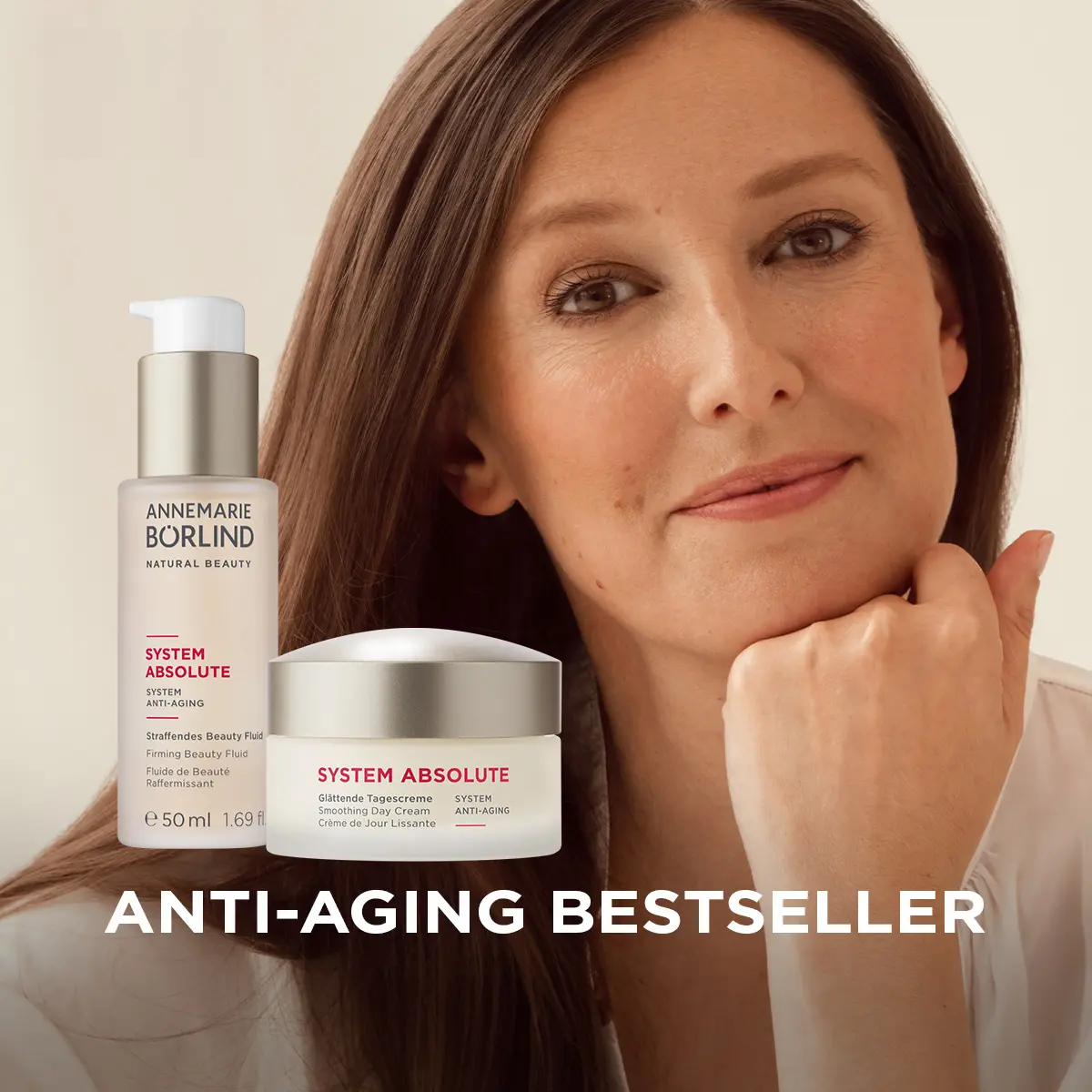 Frau mit langem braunem Haar neben ANNEMARIE BÖRLIND SYSTEM ABSOLUTE Anti-Aging Fluid und Tagescreme