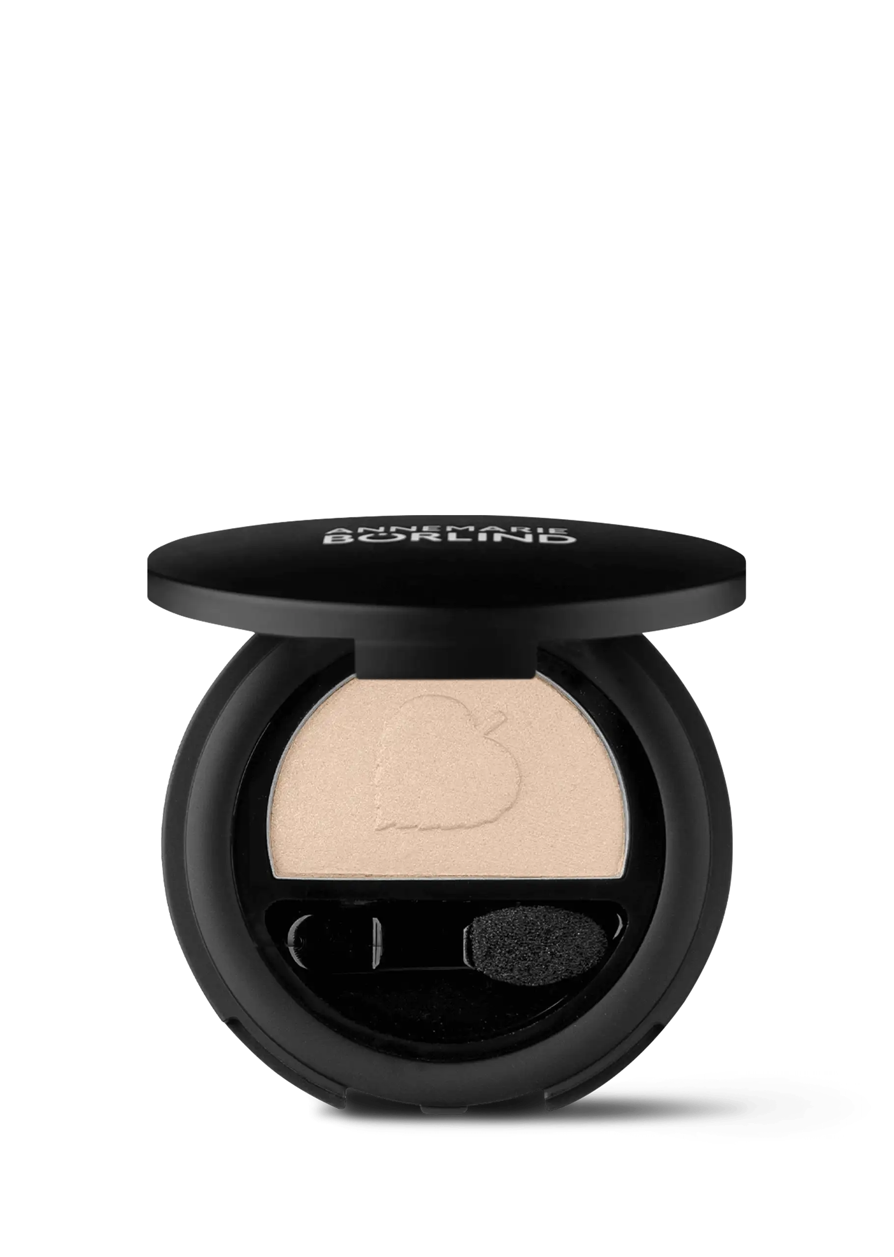 ANNEMARIE BÖRLIND Lidschatten in beige mit Applikator in runder schwarzer Dose, halb geöffnet