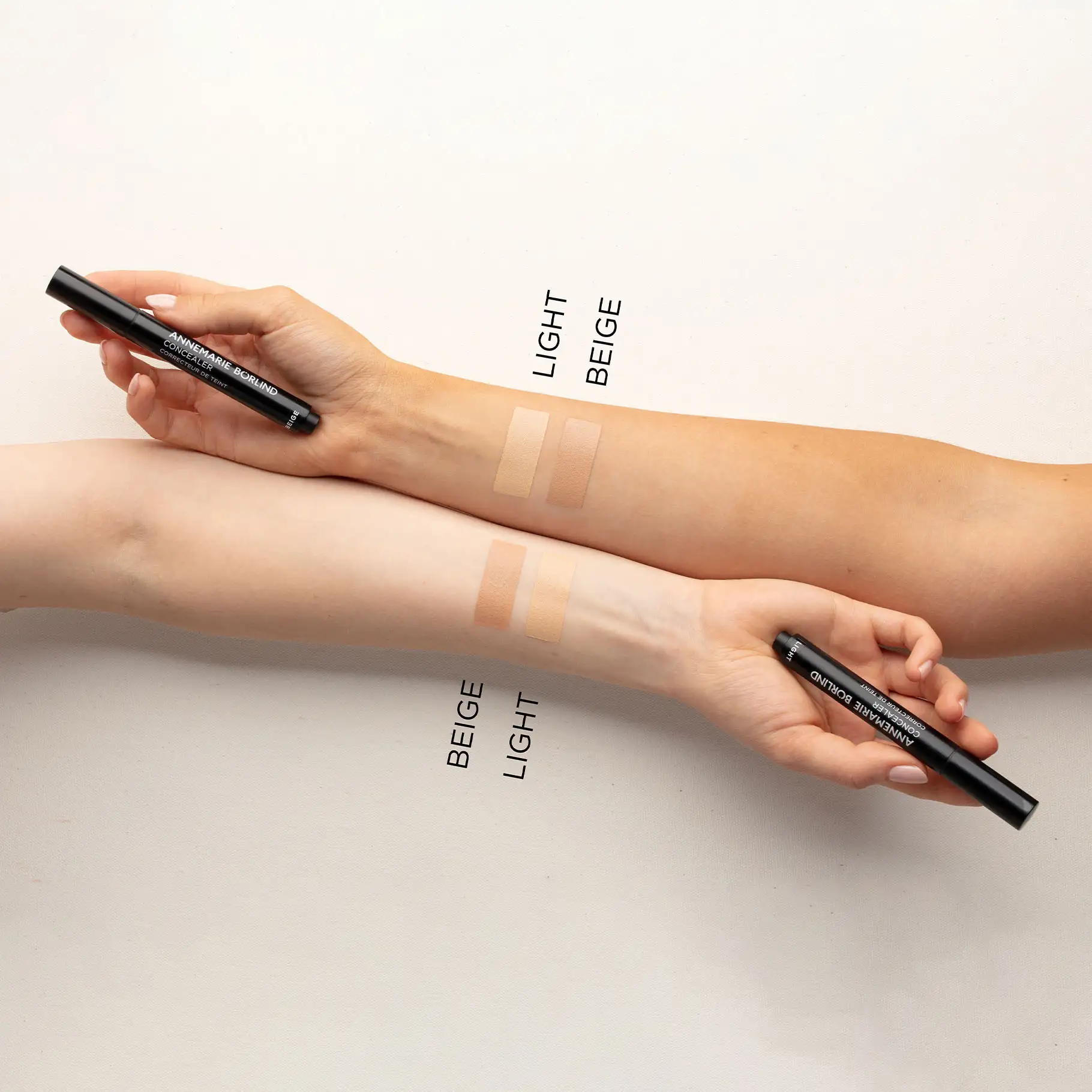 ANNEMARIE BÖRLIND Concealer in den Farbtönen Light und Beige als Swatches auf zwei Armen unterschiedlicher Hauttypen
