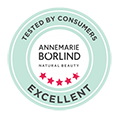 Testsiegel mit fünf roten Sternen und Schriftzug "ANNEMARIE BÖRLIND NATURAL BEAUTY EXCELLENT
