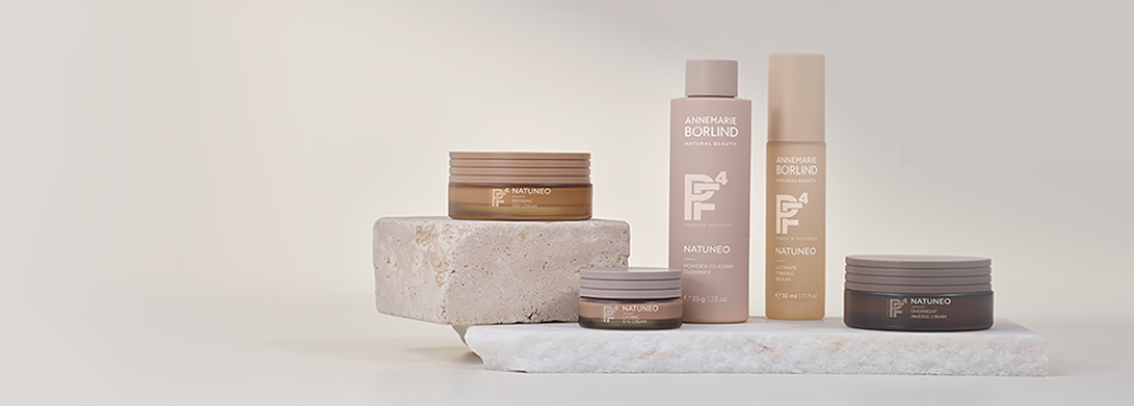 ANNEMARIE BÖRLIND NATUNEO Pflegeserie mit Cleanser, Serum, Creme und Maske auf Natursteinplatten