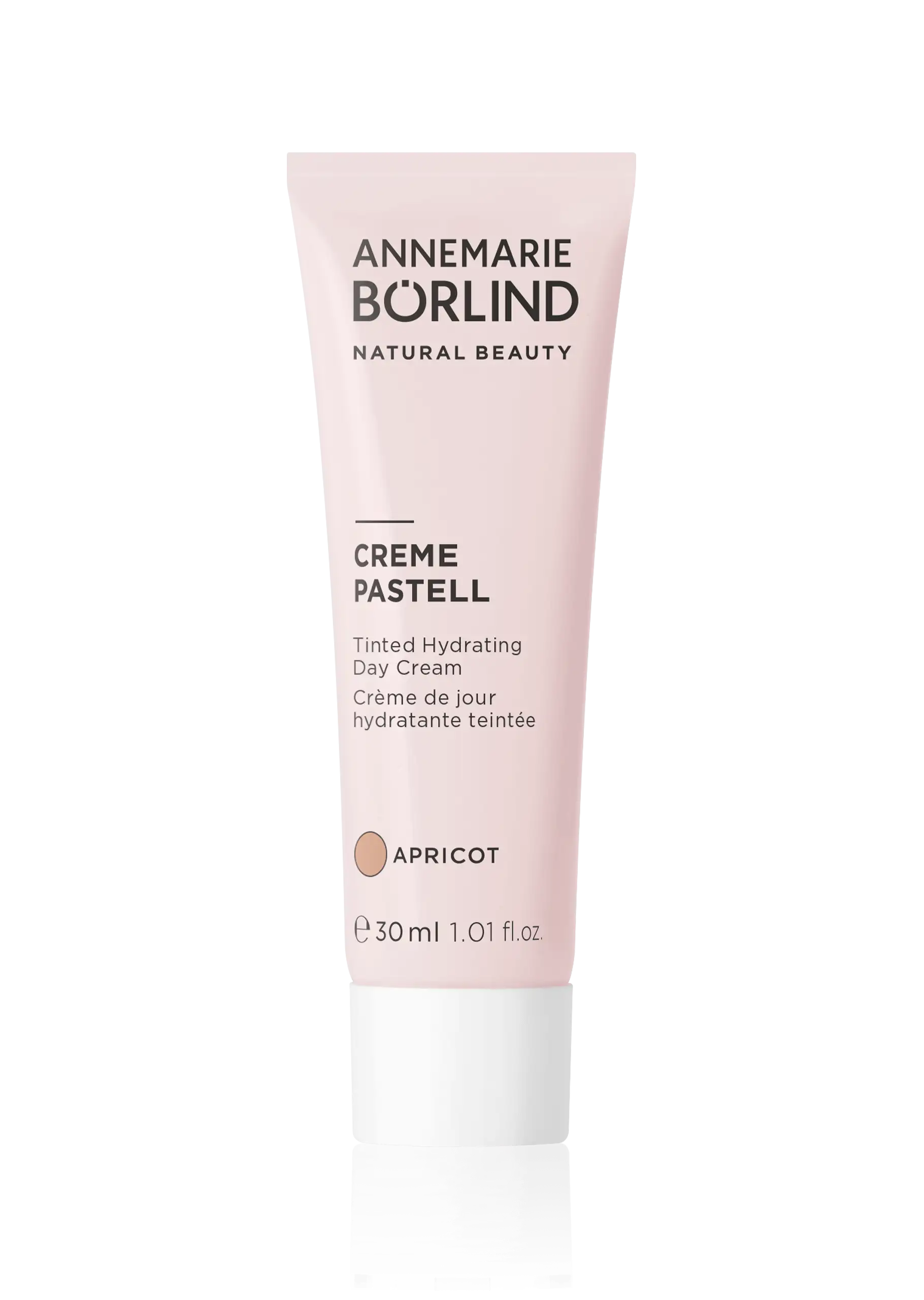 ANNEMARIE BÖRLIND Creme Pastell getönte Tagescreme Apricot, 30 ml Tube vor schwarzem Hintergrund