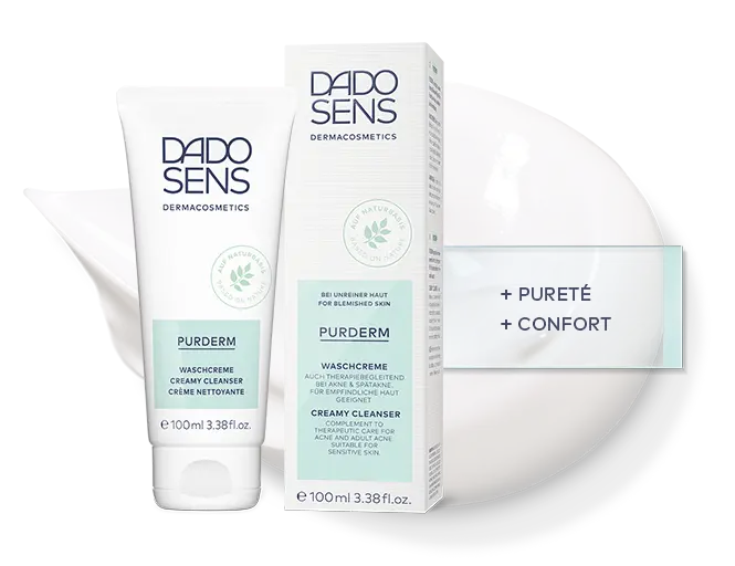 DADO SENS PURDERM Waschcreme für unreine und empfindliche Haut, 100 ml Tube und Verpackung vor Cremefleck